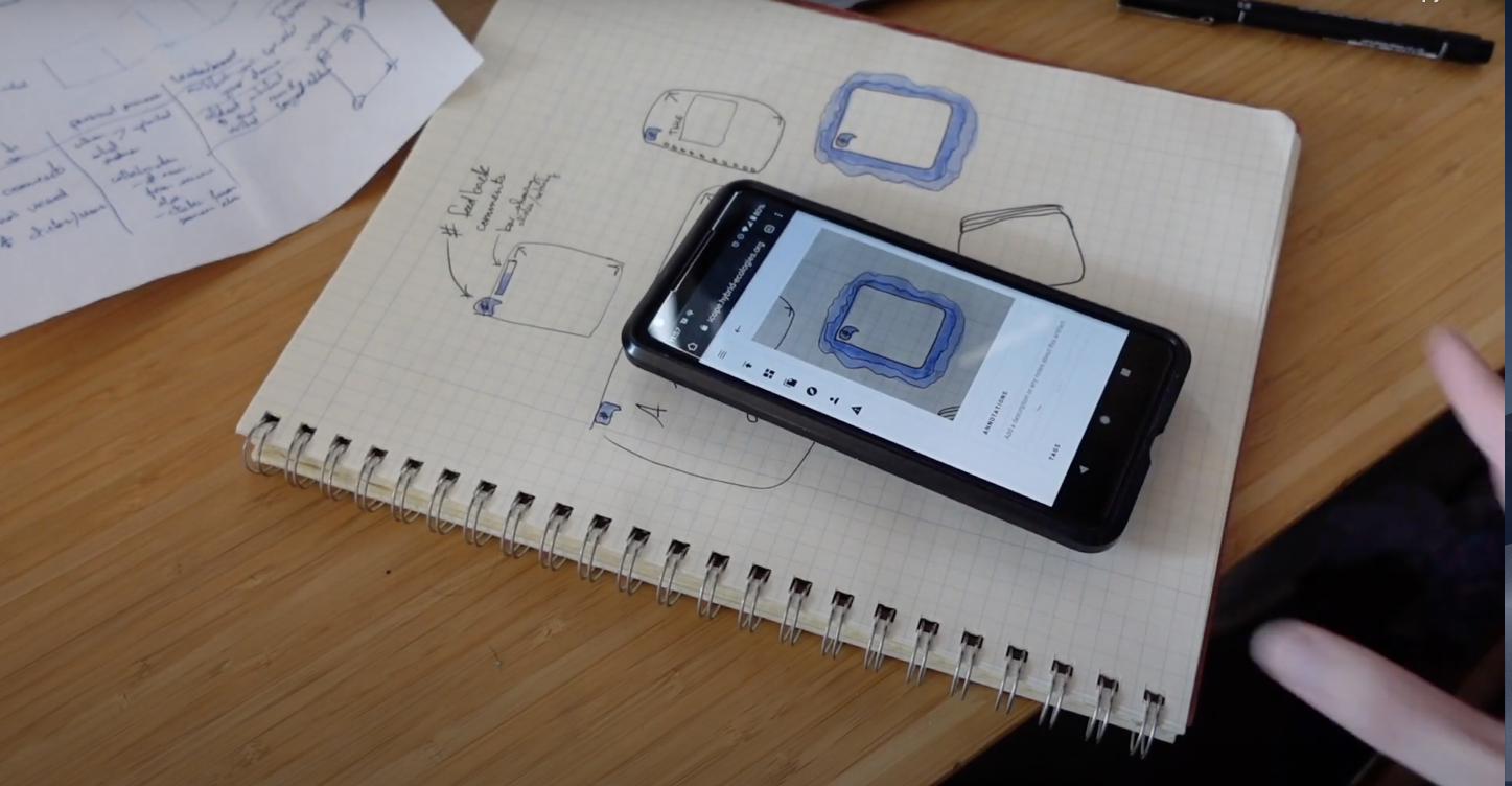 picture of a phone with notes on top of a notebook with the same notes